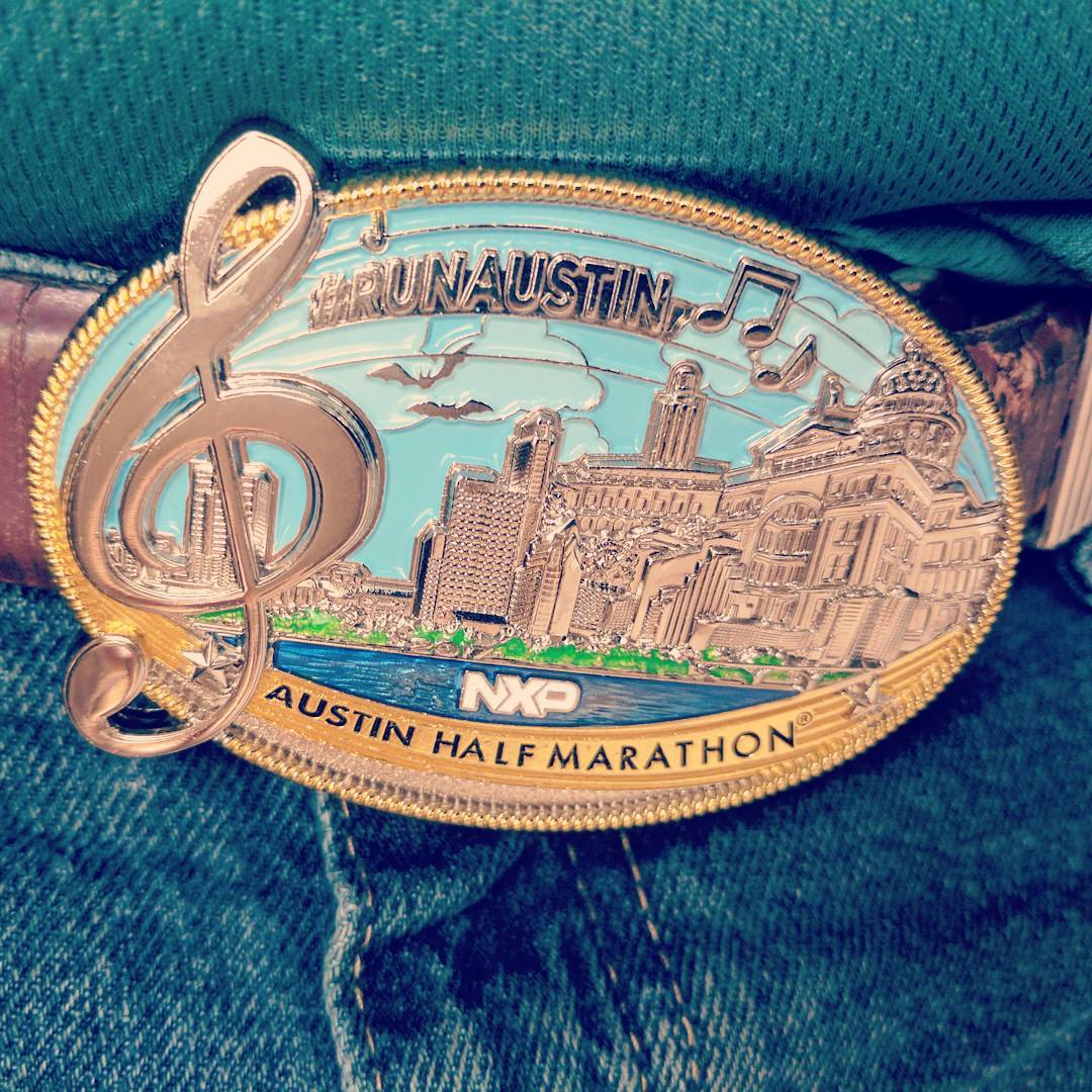 The finisher’s medal doubles as a belt-buckle at this year’s Austin Marathon and Half-Marathon. Looks great on a belt