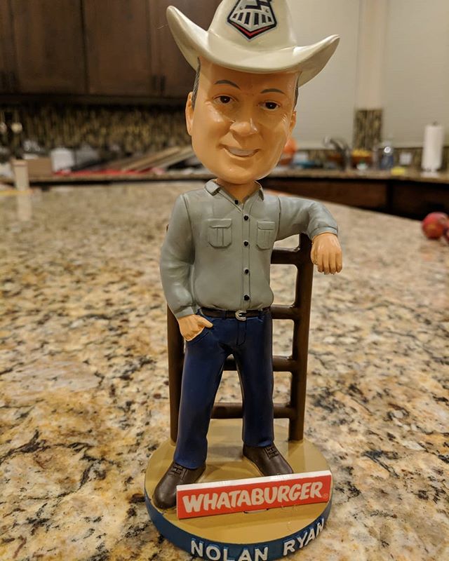 Nolan Ryan against a fence wearing a cowboy hat with a Whataburger shout-out? All in one bobblehead? Nothing you can say besides “Texas Forever”.