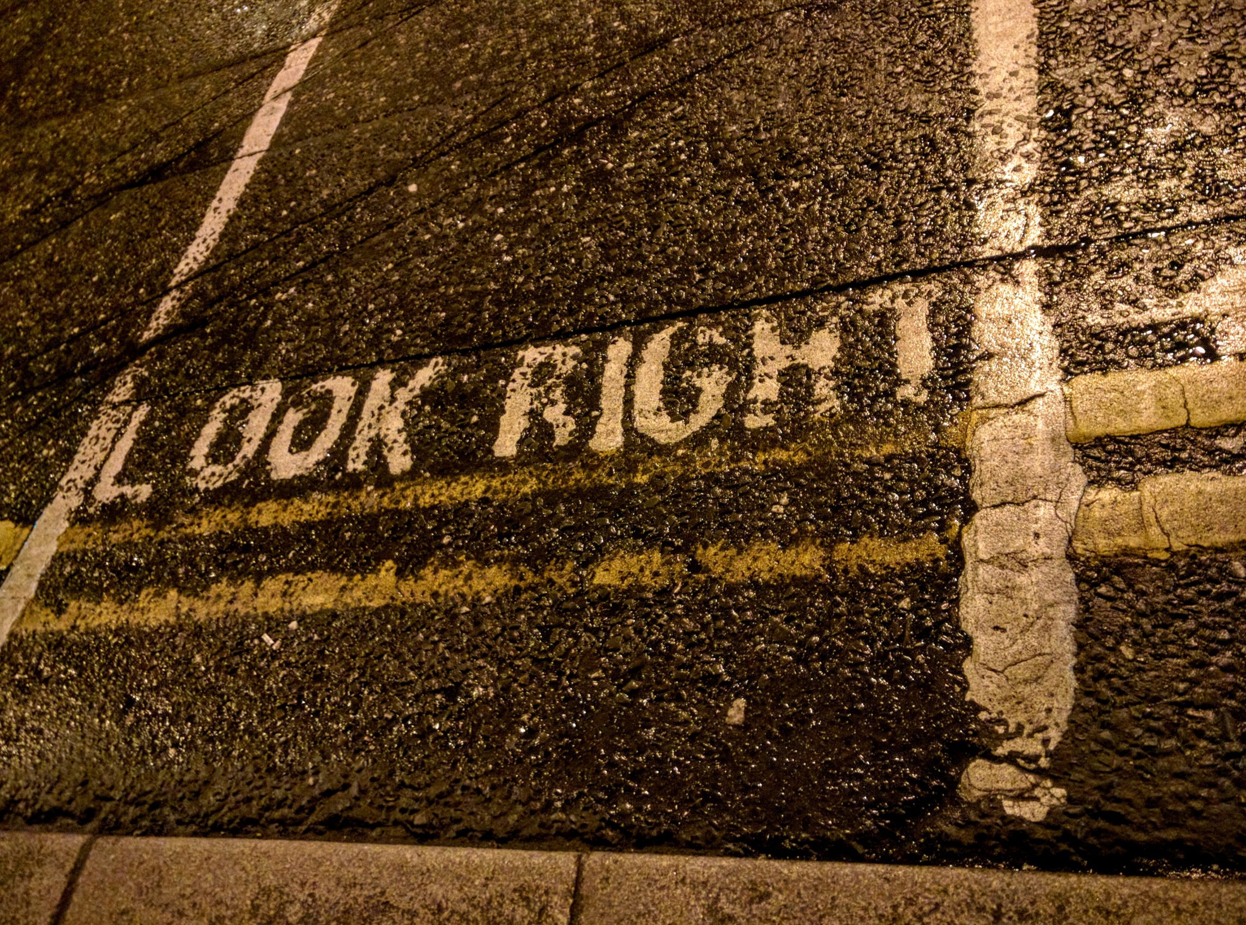 Crosswalk with "Look Right" painted at the transition to the street.