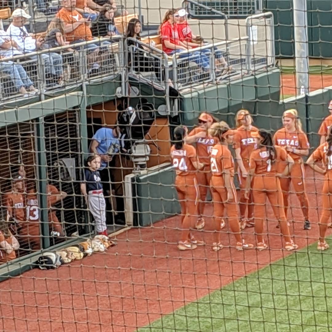 Olivia hanging out with the UT softball team. As one does