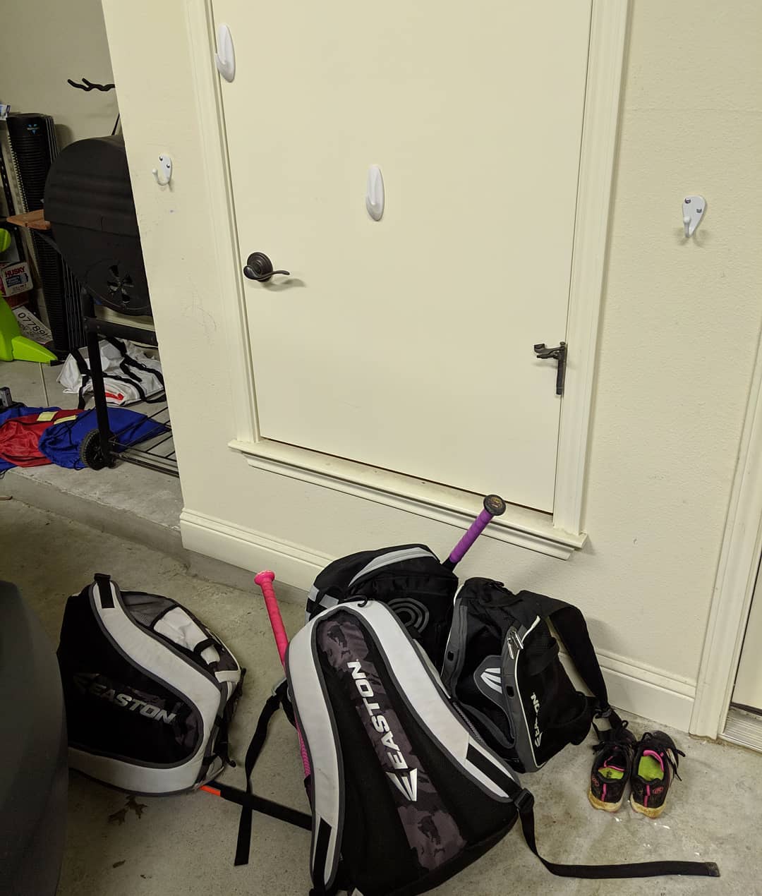 “When you get inside, put your baseball bags away.” I wonder what goes through their minds where putting the bags kinda against the wall *under* the hooks is equal to putting them *on* the hooks